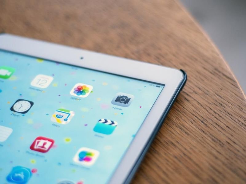 An iPad tablet on a wooden table