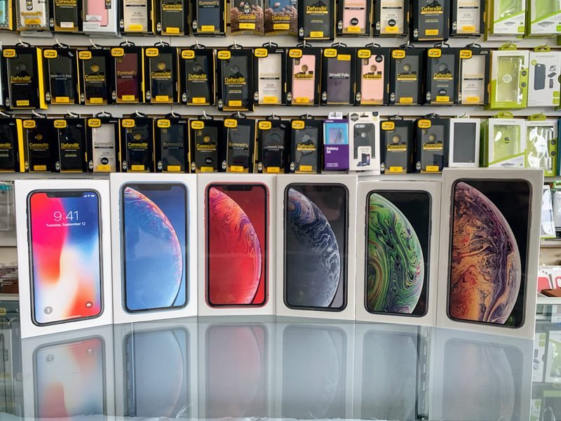 Phone cases and smartphones on display inside the Vision Mobile store